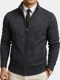Charcoal textured zip-front cardigan with a structured collar, ribbed trim, and long sleeves worn over a shirt and tie.