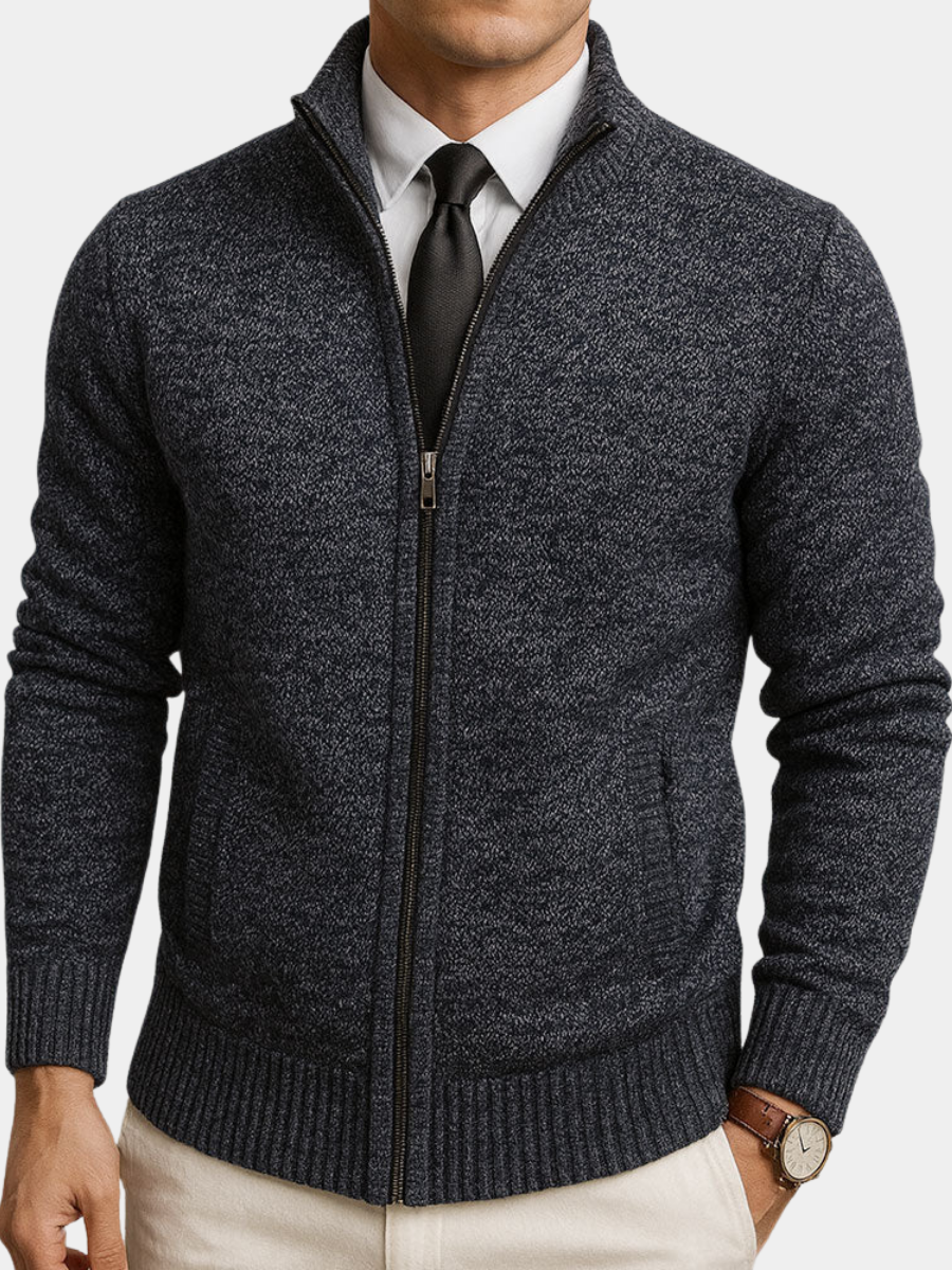 Charcoal textured zip-front cardigan with a structured collar, ribbed trim, and long sleeves worn over a shirt and tie.