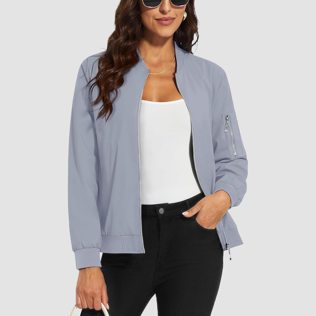 Light blue lightweight bomber jacket with a zip sleeve pocket, ribbed trim, and water-resistant polyester finish.