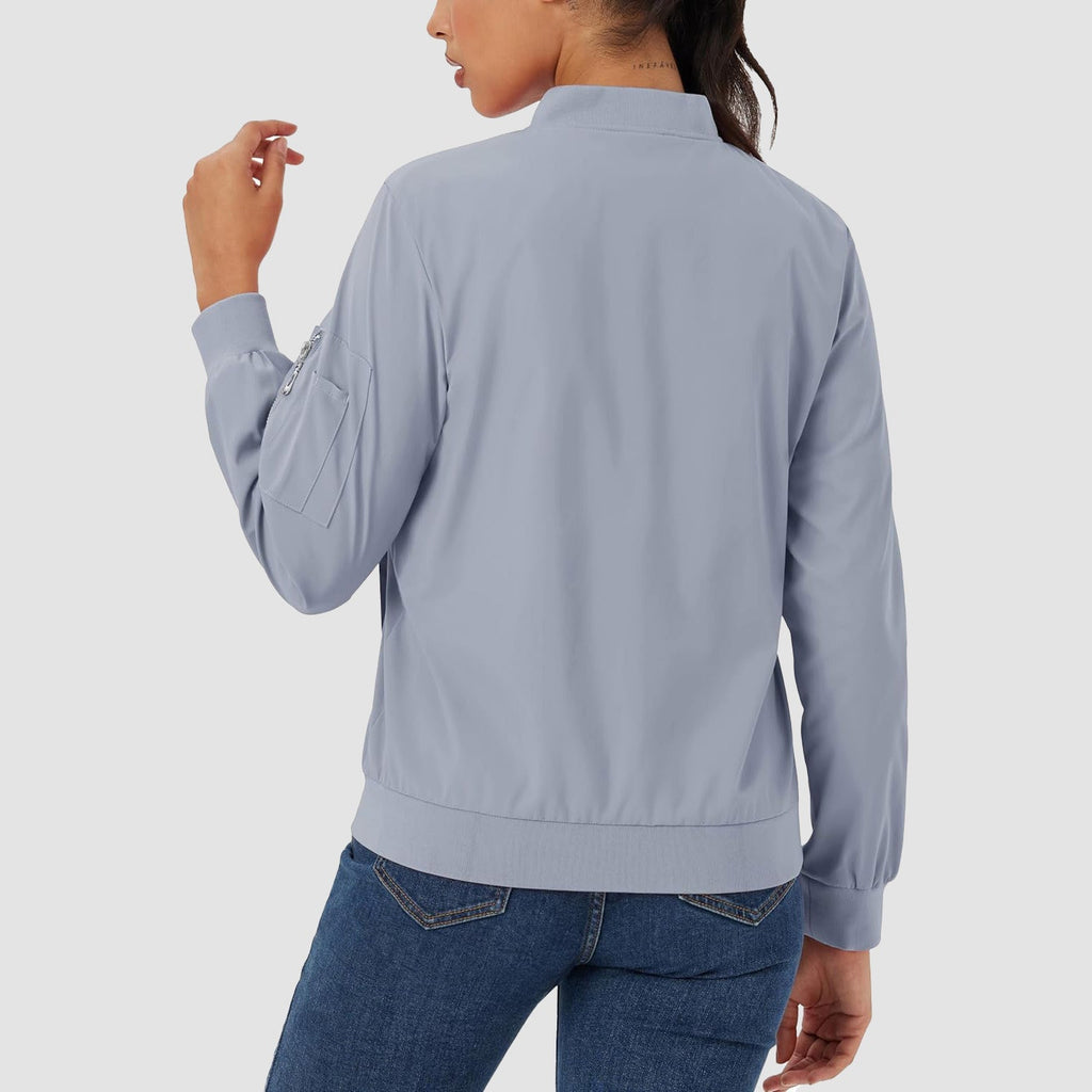 Light blue lightweight bomber jacket with a ribbed collar, zip sleeve pocket, and smooth, water-resistant finish.