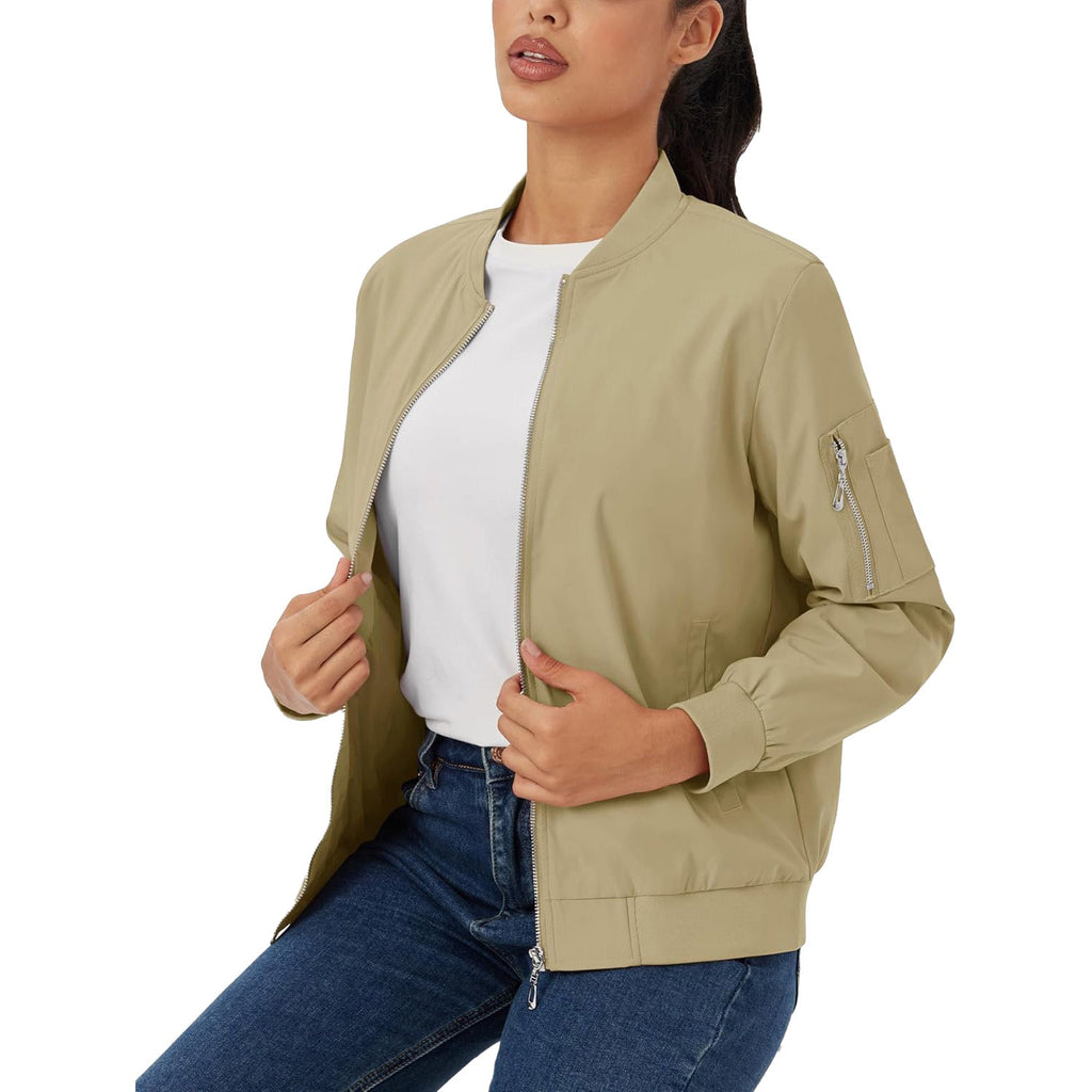 Lightweight beige bomber jacket in water-resistant polyester with a zip sleeve pocket, ribbed trim, and front zip closure.
