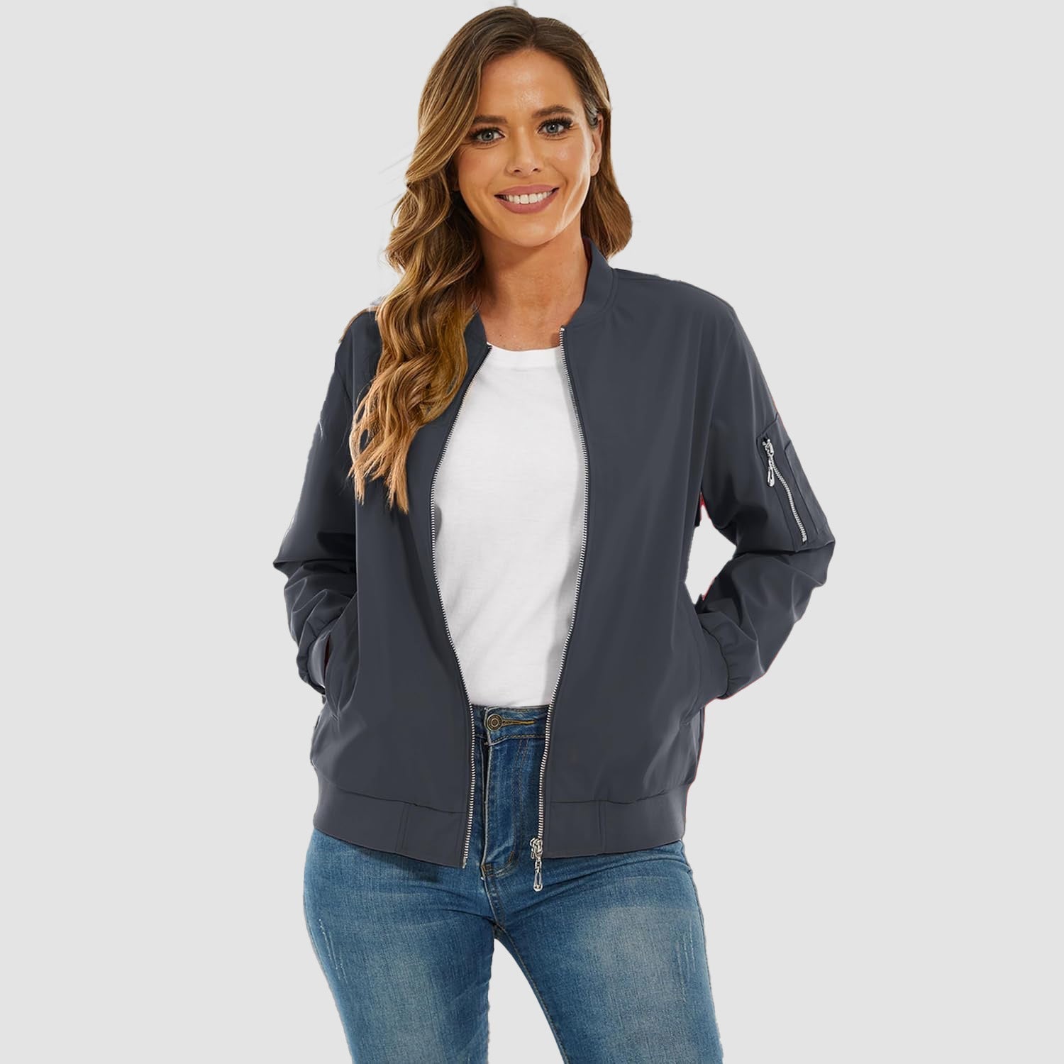 Charcoal grey lightweight bomber jacket with a zip sleeve pocket, ribbed trim, and a water-resistant finish.