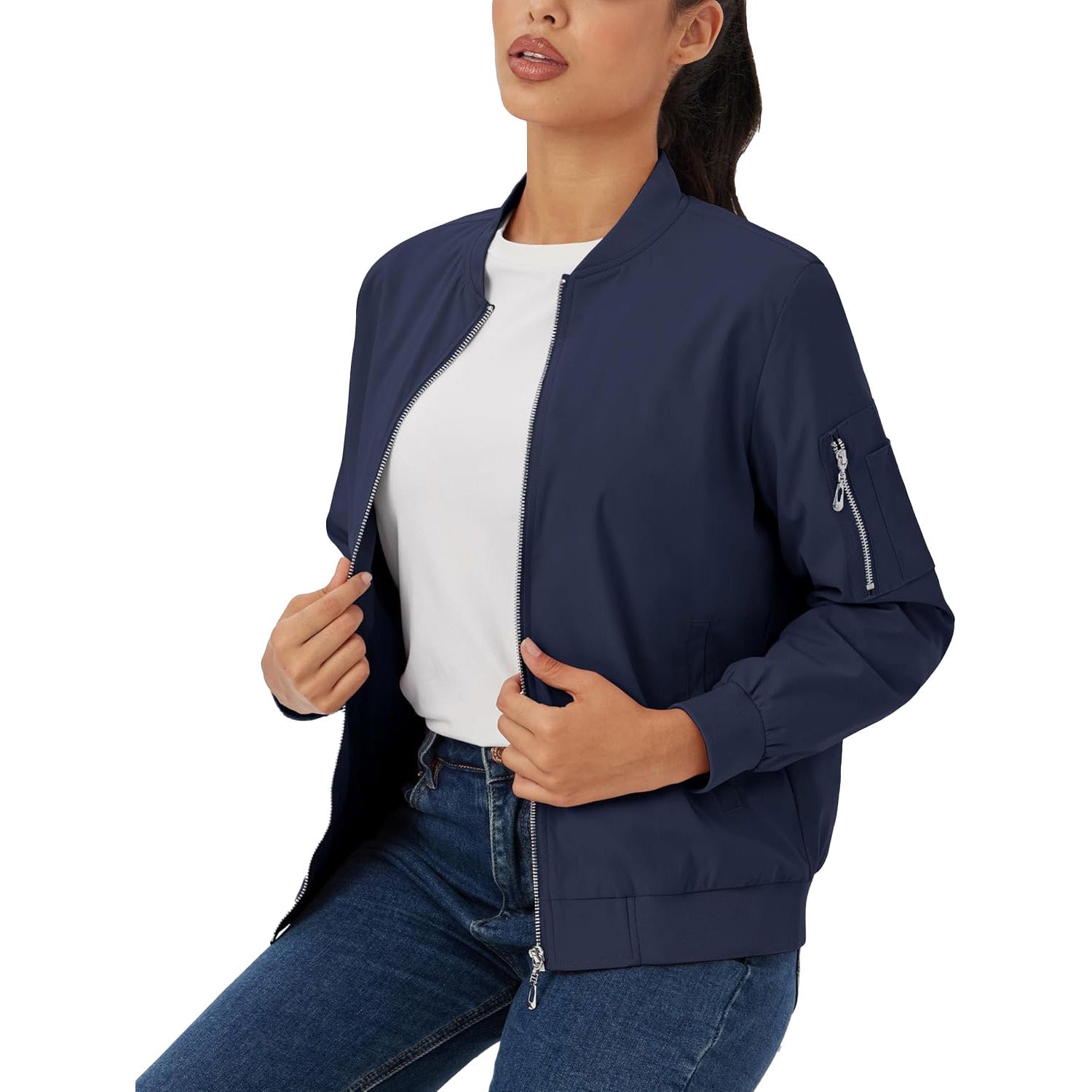 Navy blue lightweight bomber jacket with a zip-up front, ribbed trim, and a utility sleeve pocket worn over denim.