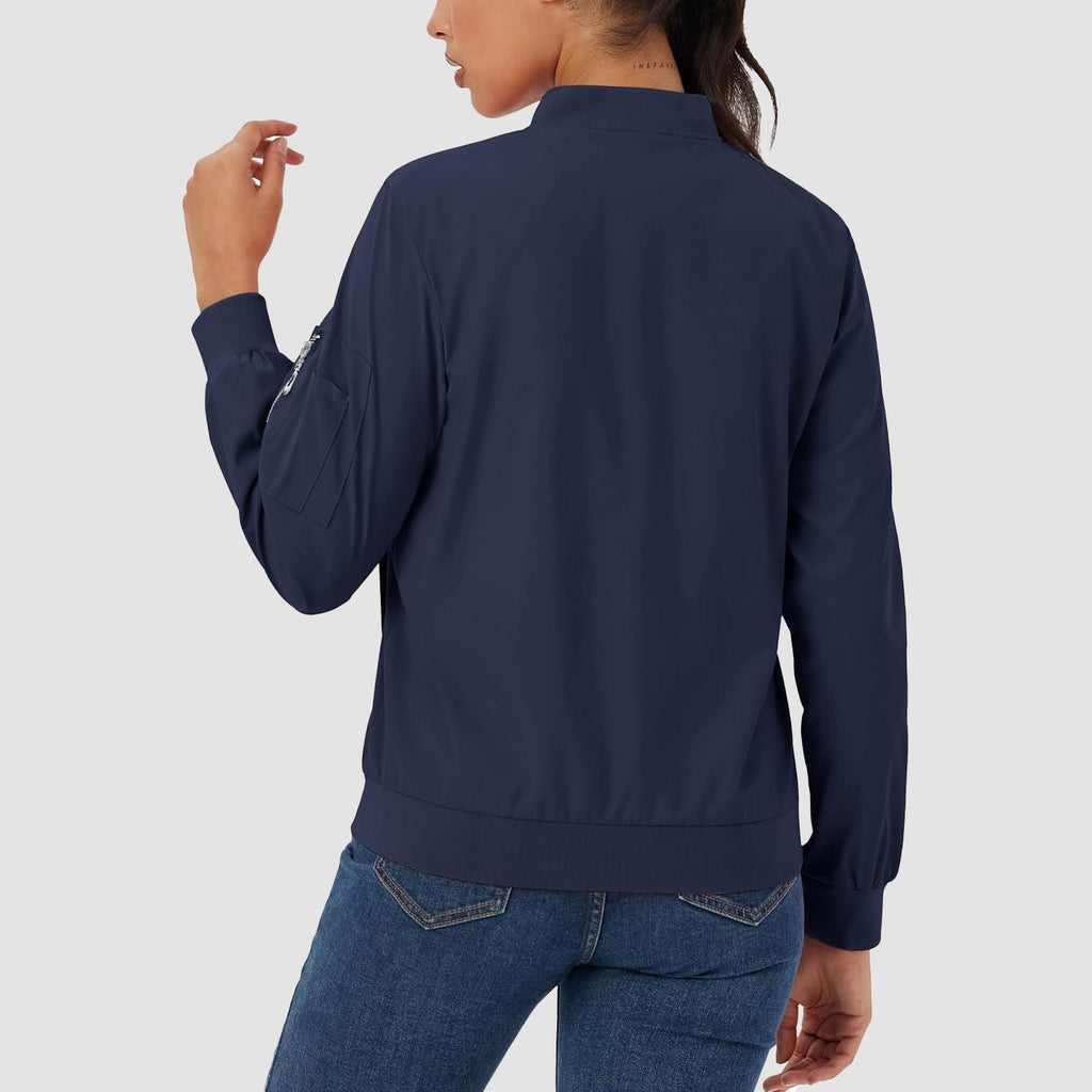 Navy blue lightweight bomber jacket in water-resistant polyester with a zip sleeve pocket and ribbed hem.