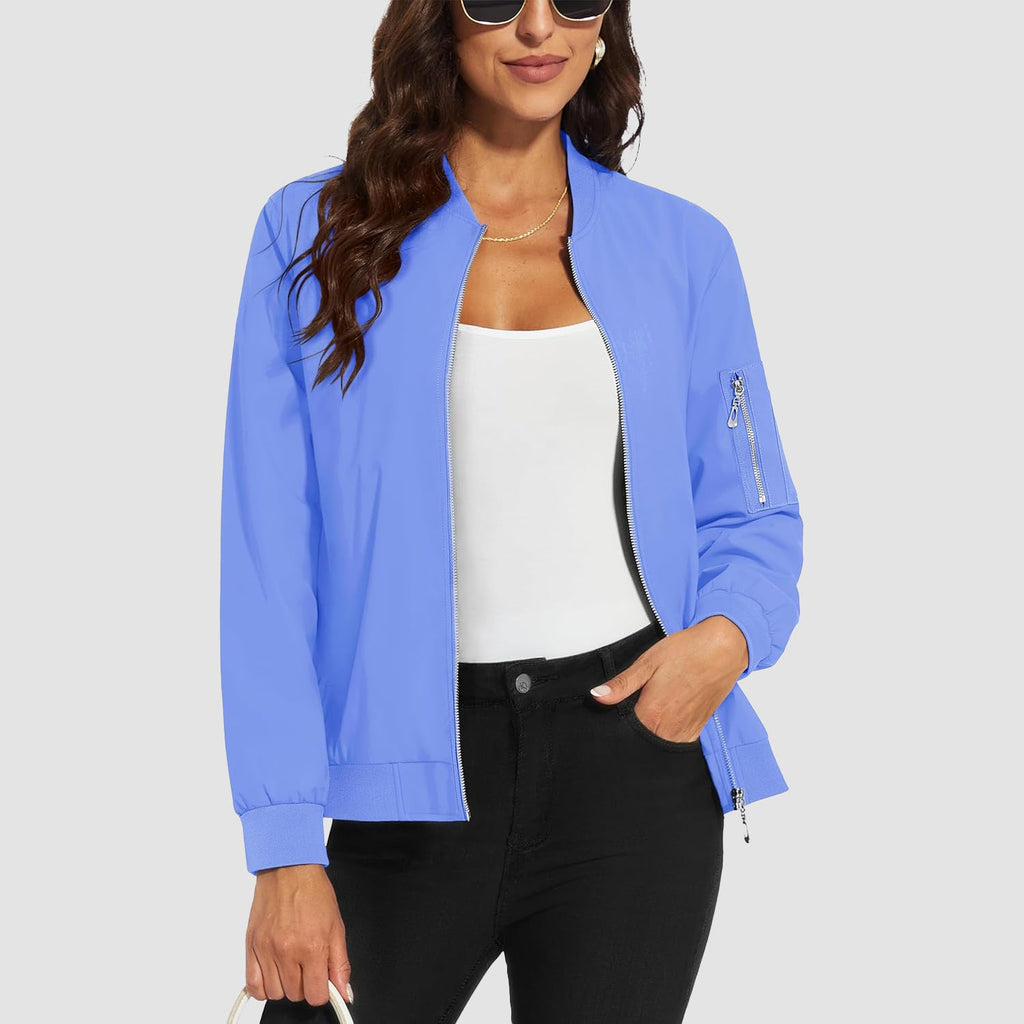 Blue lightweight bomber jacket in water-resistant polyester with a zip sleeve pocket, ribbed trim, and a slim fit.