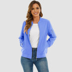 Light blue lightweight bomber jacket with a zip-up front, ribbed trim, and utility sleeve pocket worn over jeans.