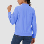Lightweight blue bomber jacket in water-resistant polyester with a zip sleeve pocket, ribbed trim, and a classic fit.