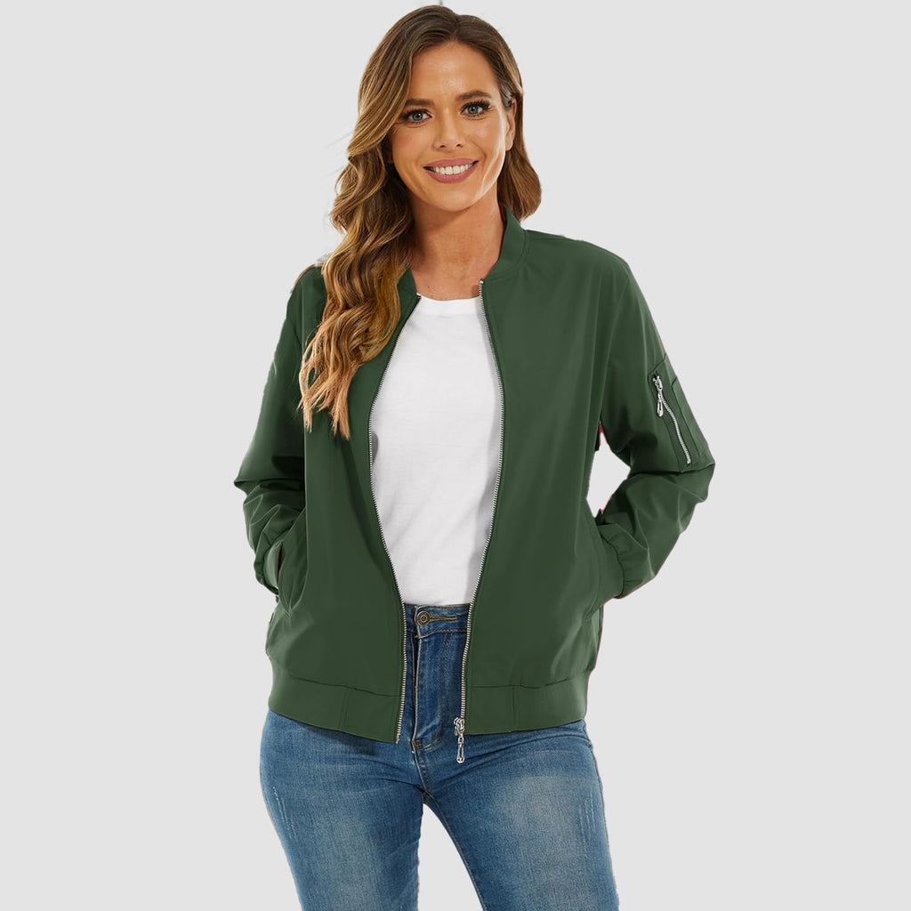 Dark green lightweight bomber jacket with a zip-up front, ribbed trim, and utility sleeve pocket worn over denim.