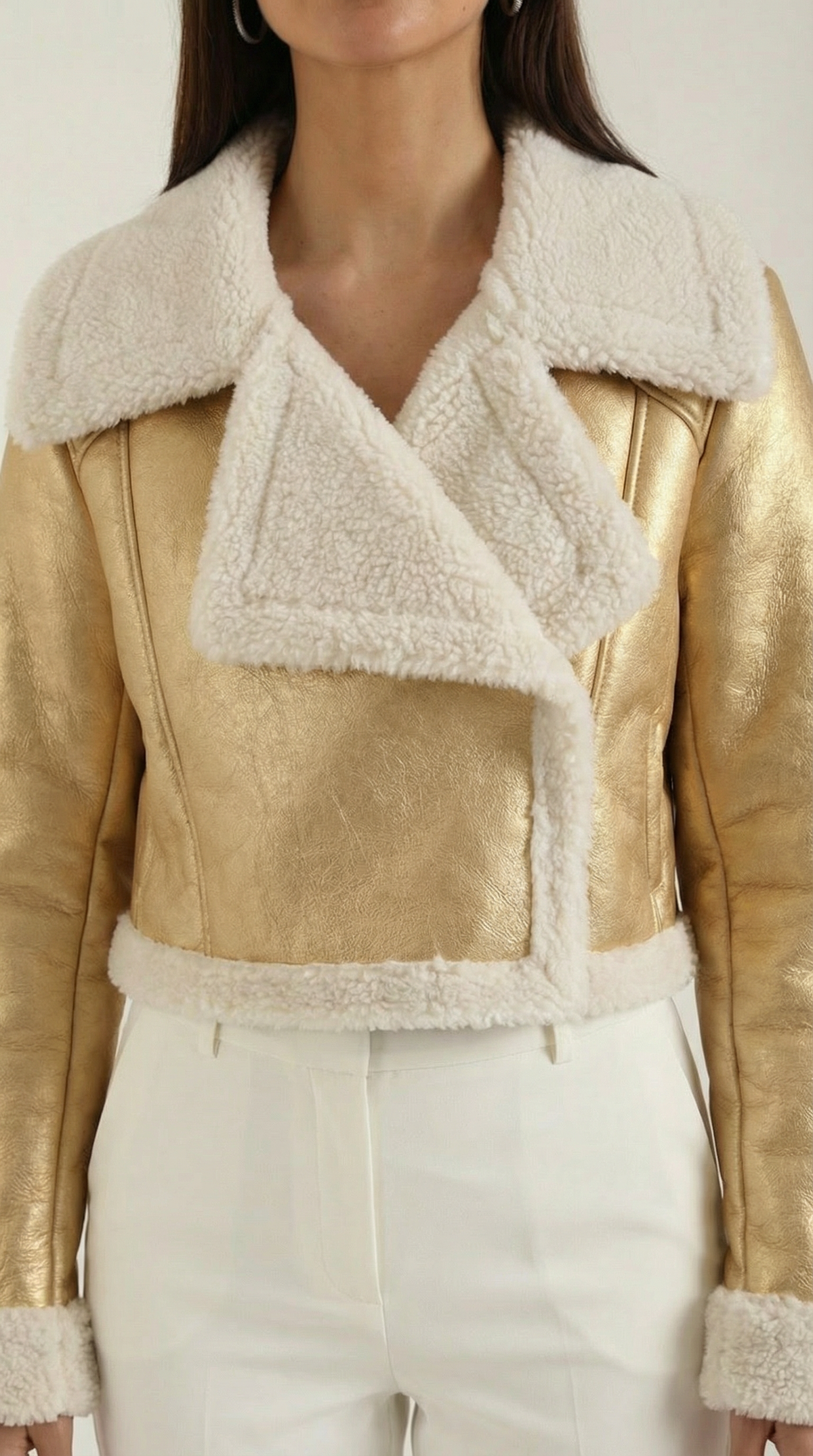 Gold cropped leather aviator jacket featuring a plush cream shearling collar, cuffs, and hem trim.