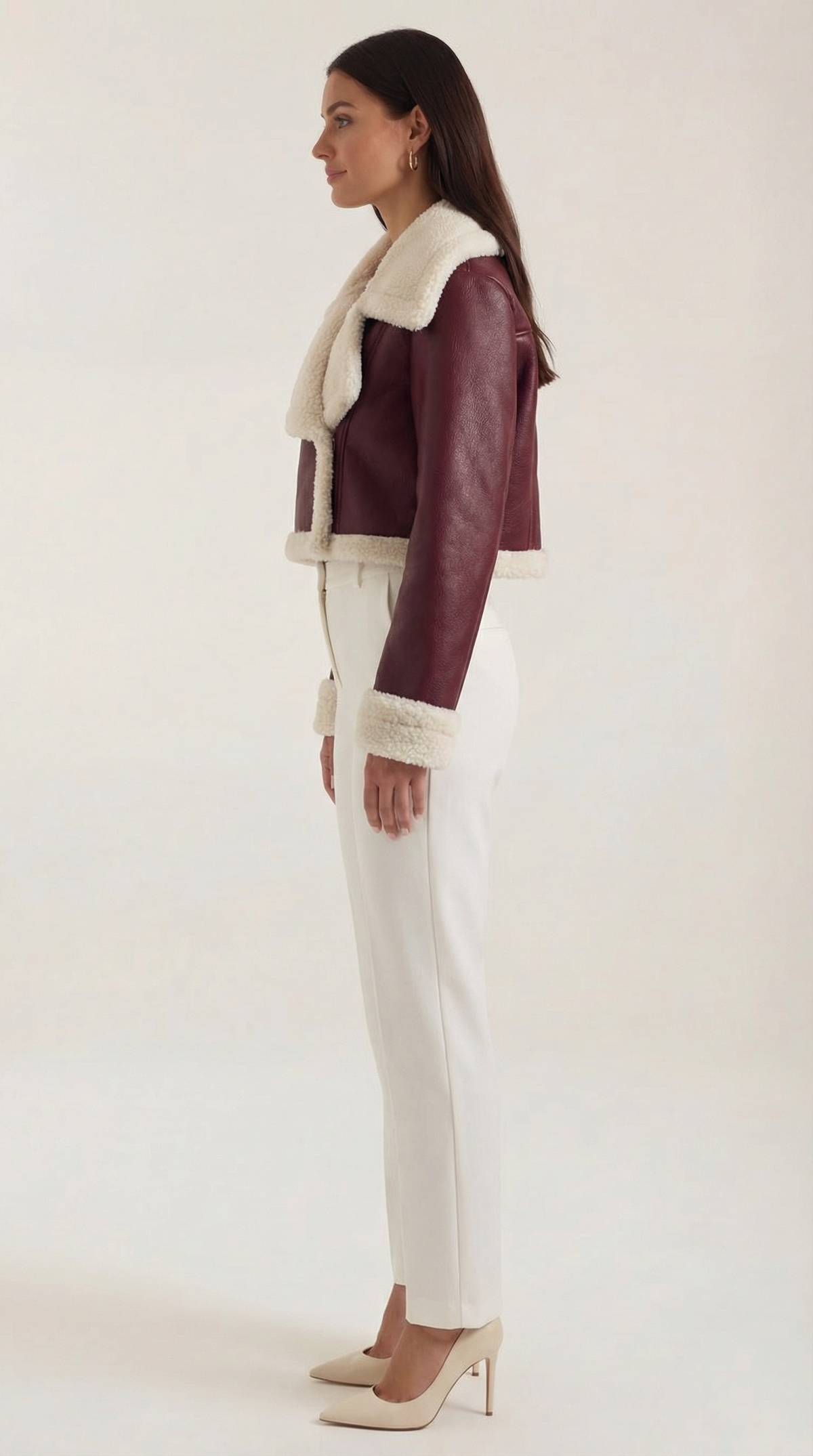 Cropped burgundy leather aviator jacket with plush cream shearling trim on the collar, cuffs, and hem.