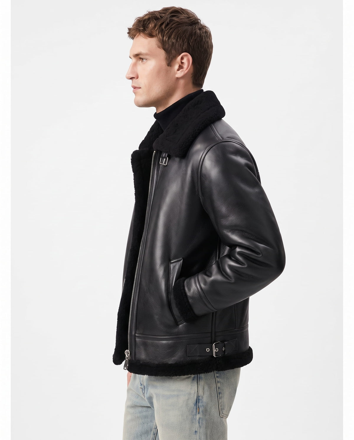 Black leather aviator jacket with plush shearling lining, asymmetric zip closure, and adjustable buckle hem details.