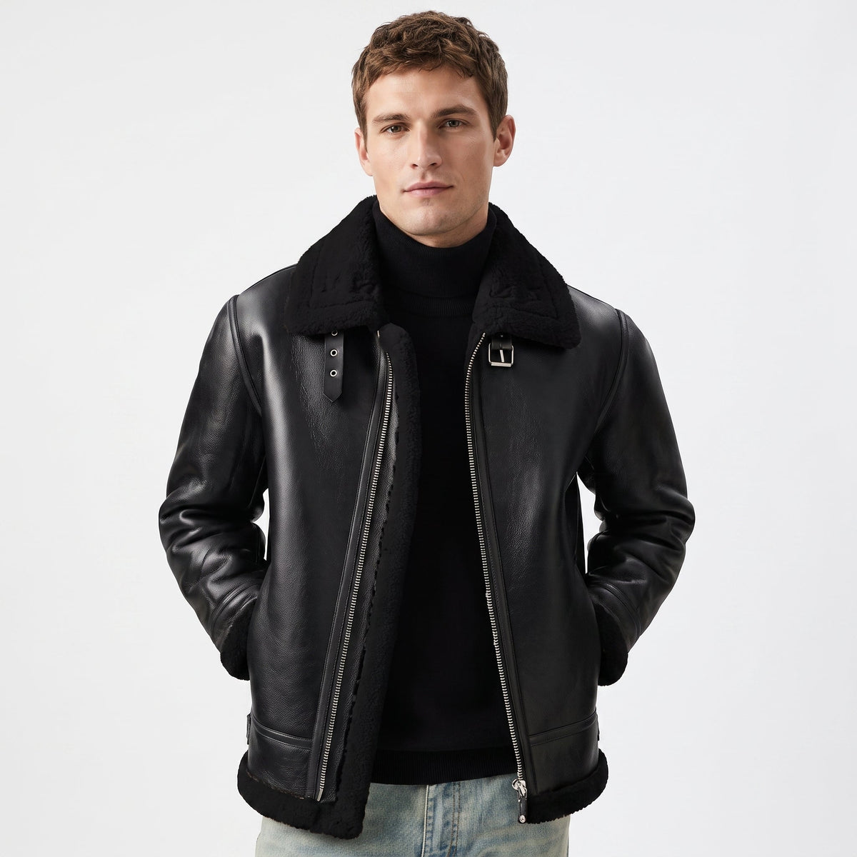 Black leather aviator jacket featuring a plush shearling collar, asymmetric zip closure, and buckle strap details.