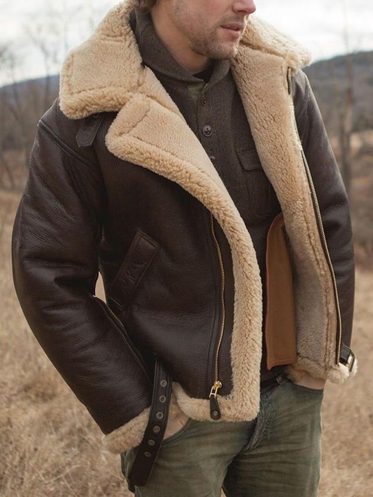 A man wearing a brown leather aviator jacket with shearling lining and a full-zip front, shown in side view