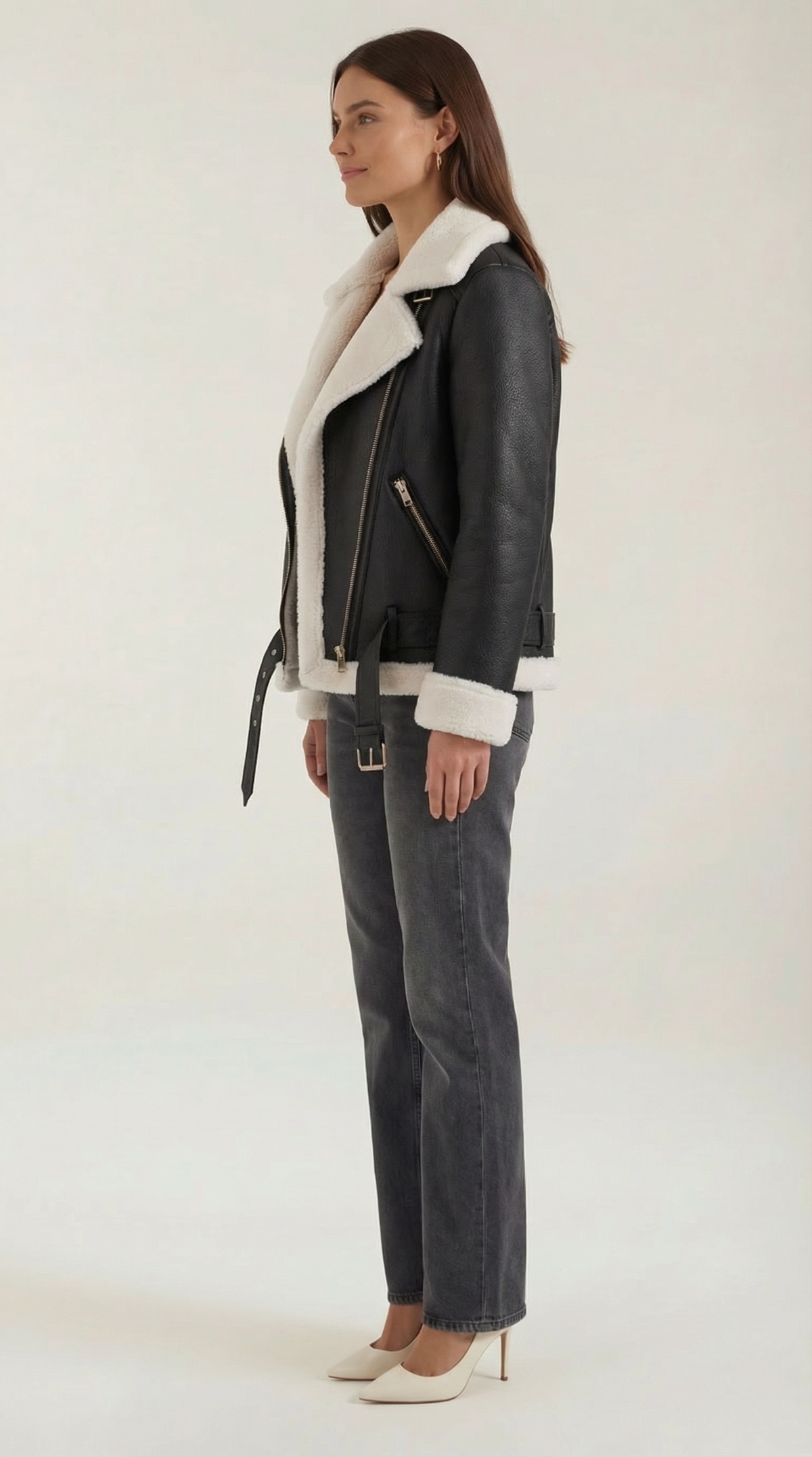 Black and white leather aviator jacket with white shearling trim, diagonal zip front, and adjustable belted hem.