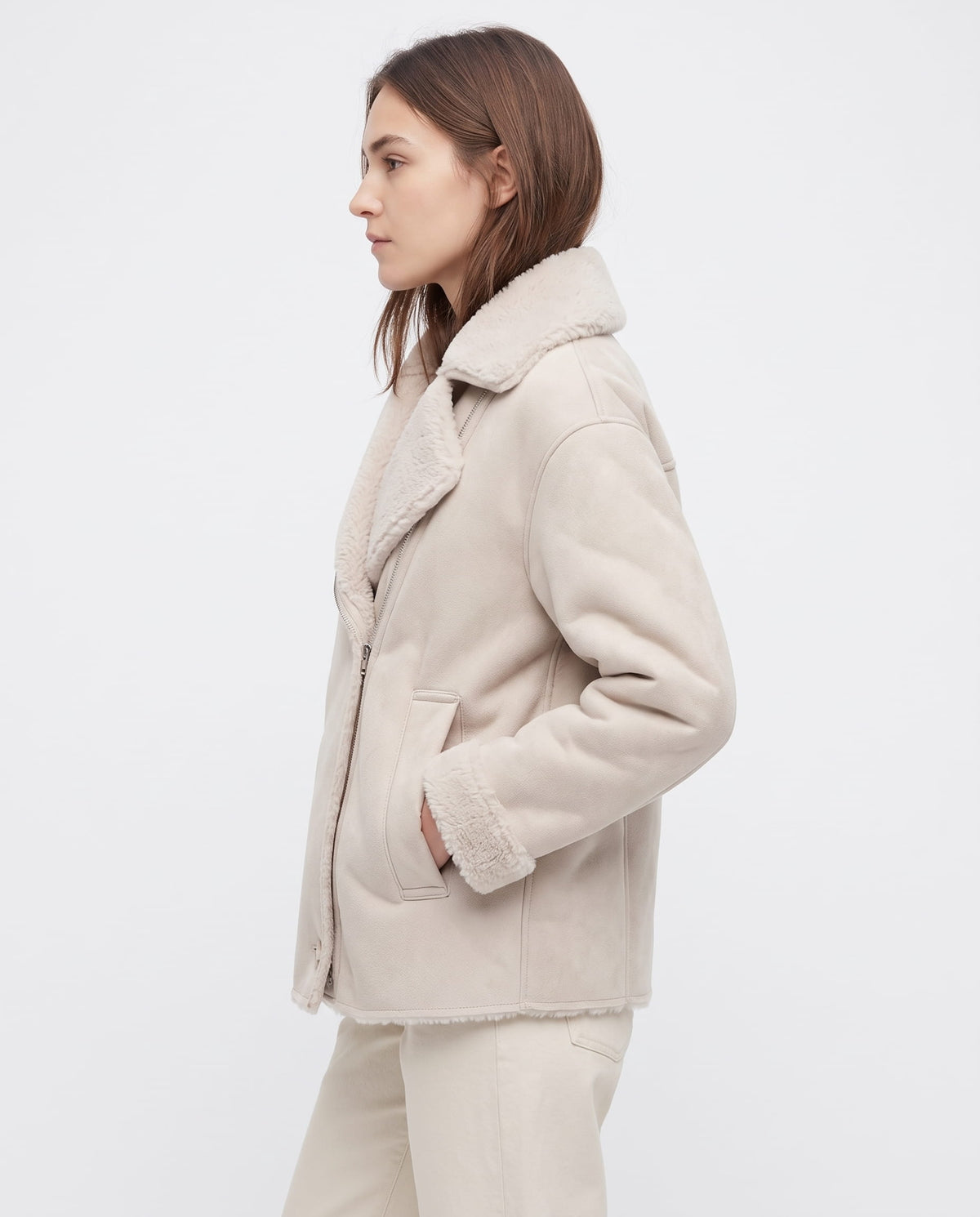 Oversized cream leather aviator jacket with a plush sherpa collar, wide lapels, and side patch pockets.