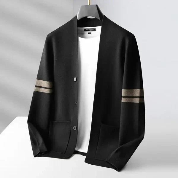 Black lightweight tailored cardigan with contrast sleeve stripes, open front, and patch pockets over a white shirt.
