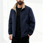 Navy blue polar fleece jacket with a plush tan sherpa-lined stand collar, zip front, and elastic cuffs.