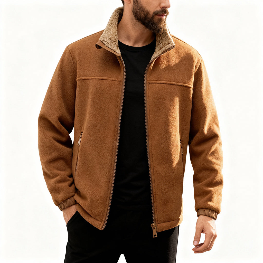 Tan polar fleece jacket with a plush sherpa-lined stand collar, zip front, and elastic cuffs worn over a black shirt.