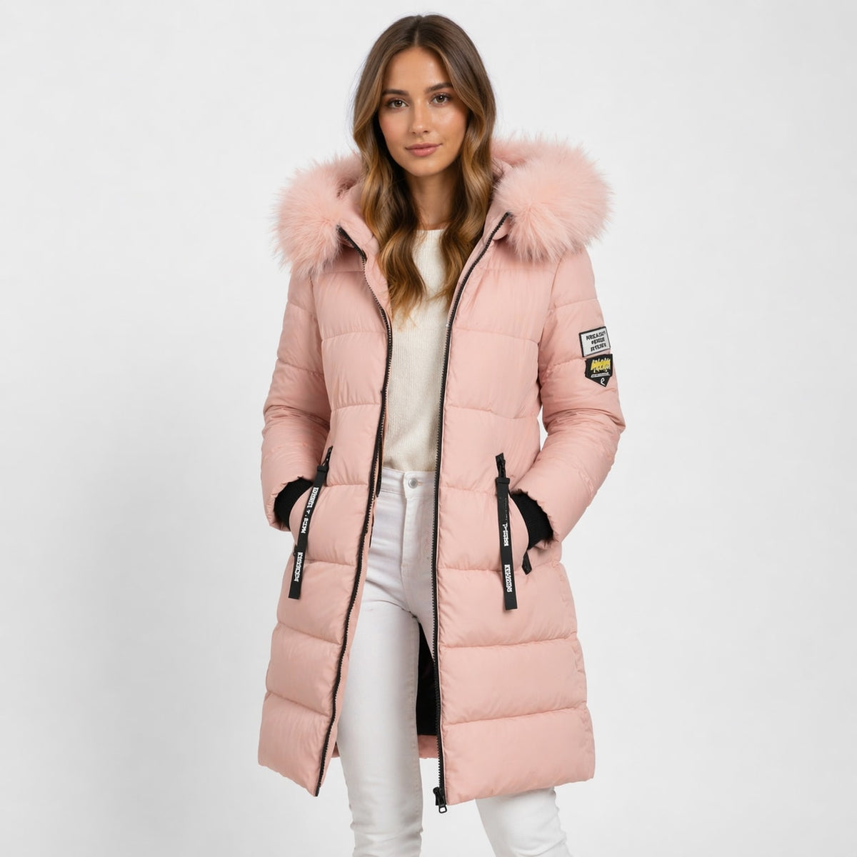 Blush pink longline quilted parka with a faux-fur trimmed hood, two-way zip, and zip hand pockets.