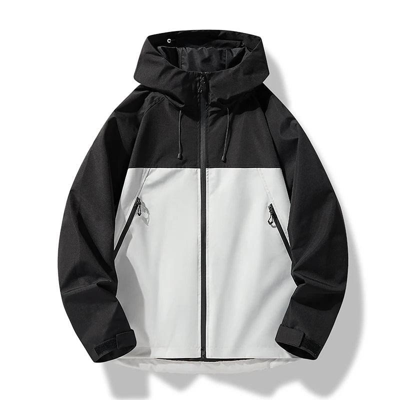 Black and white color-block hooded zip-up windbreaker jacket with zippered pockets and adjustable drawstrings displayed on a white background.