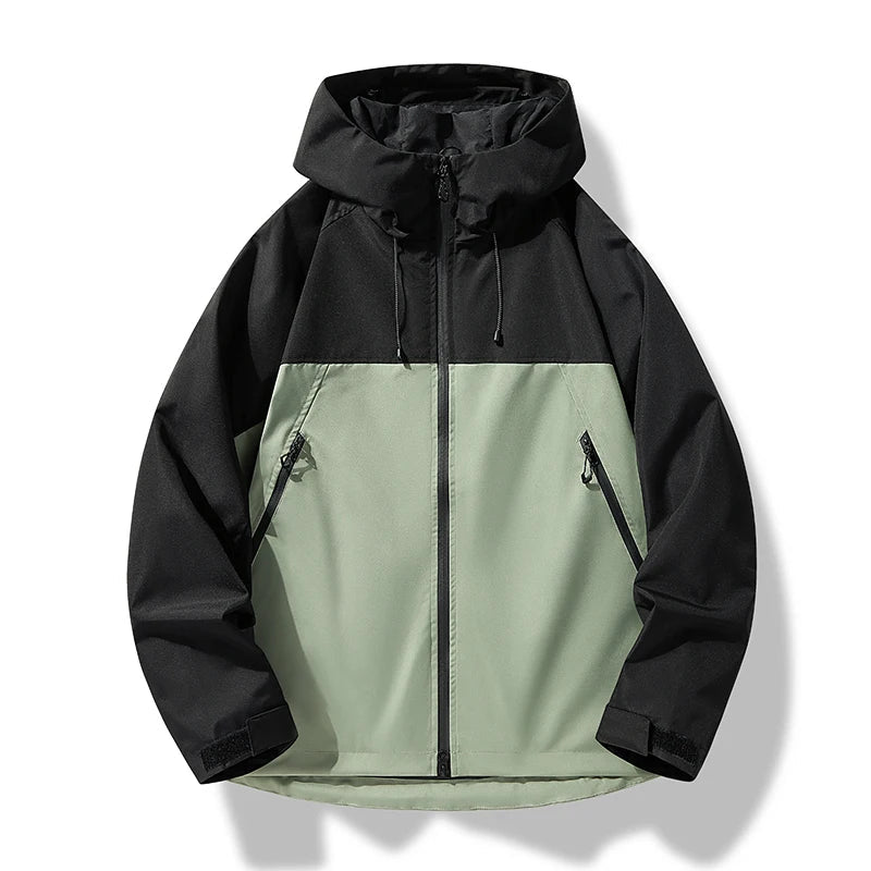 Black and sage green color-block hooded zip-up windbreaker jacket featuring zippered pockets and adjustable drawstrings on a white background.