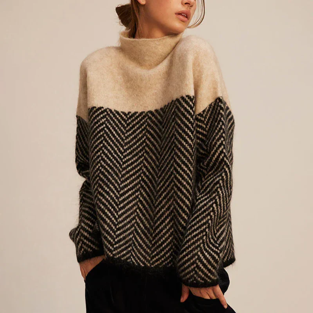Beige and gray color-block turtleneck sweater featuring a herringbone knit design, oversized silhouette, and relaxed long sleeves.