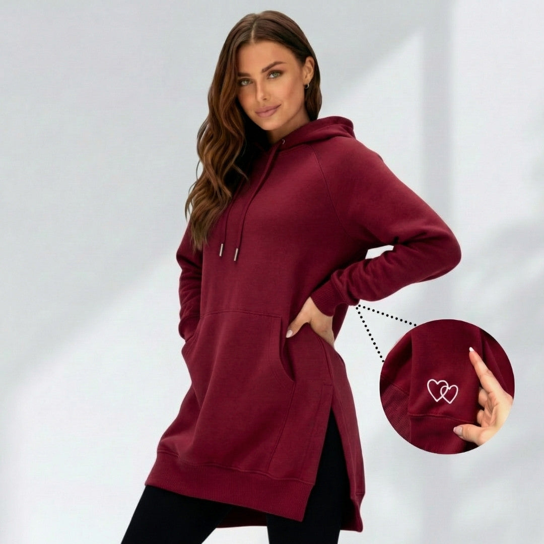 Burgundy oversized brushed cotton hoodie with a longline fit, side slits, drawstring hood, and heart embroidery detail.