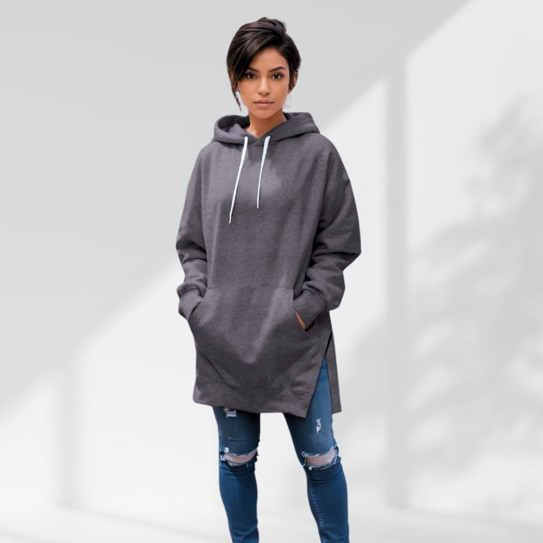 Charcoal grey oversized brushed cotton hoodie with a longline silhouette, drawstring hood, and side-slit hem.