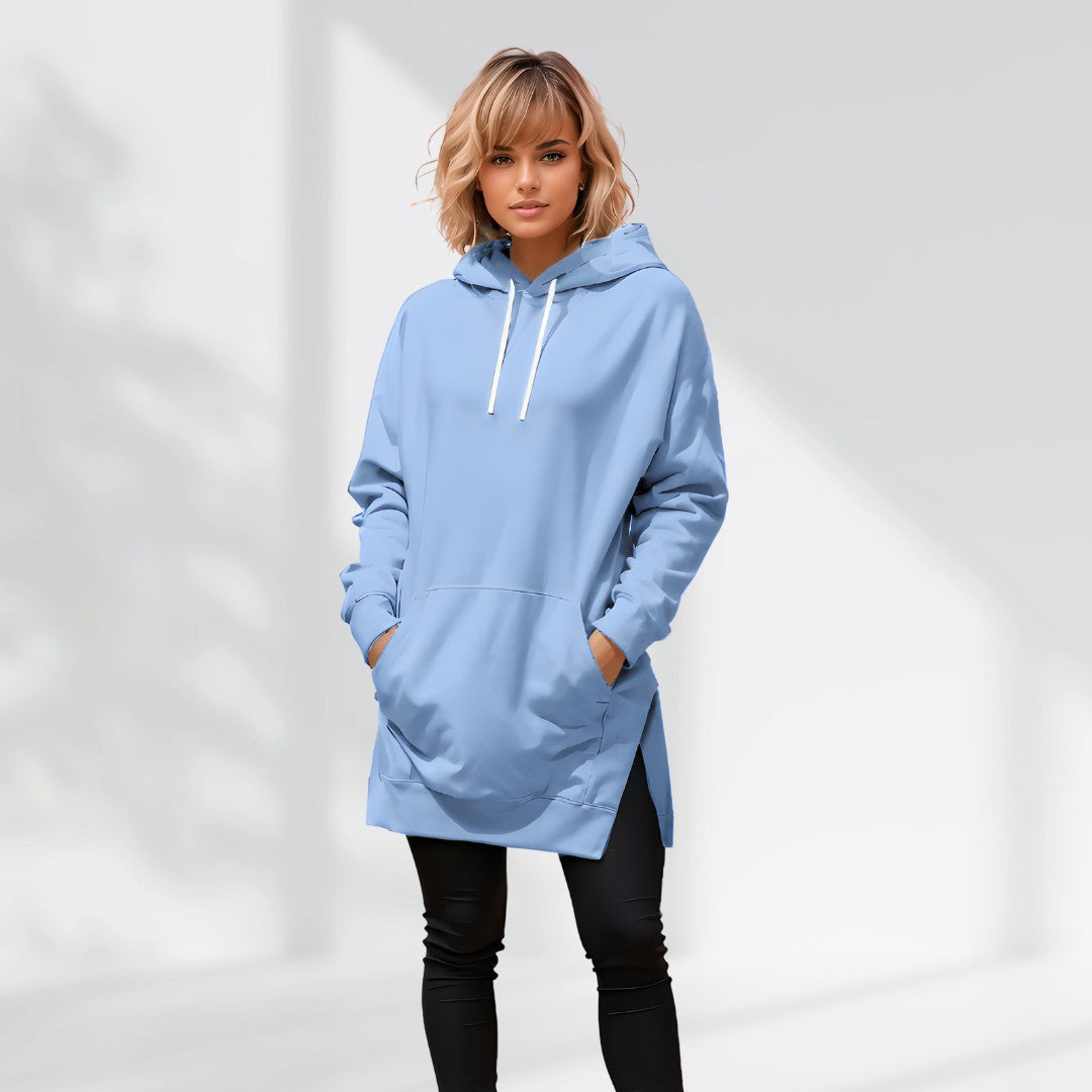 Light blue oversized brushed cotton hoodie with a drawstring hood, longline silhouette, and side-slit hem.