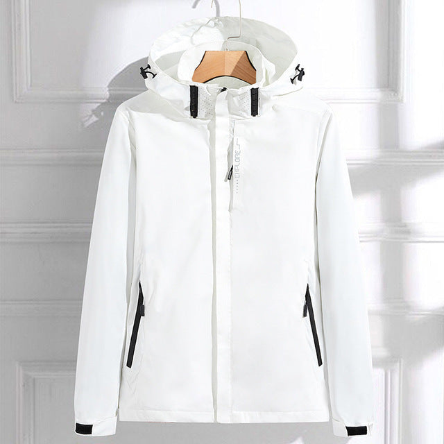 White hooded waterproof jacket featuring a full-zip front, adjustable hood, zippered pockets, and long sleeves on a white background.