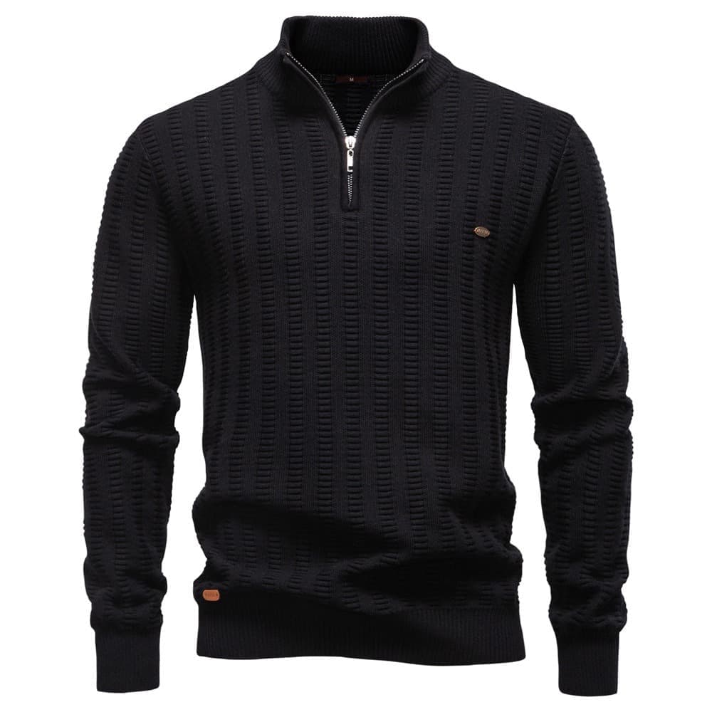 Black textured quarter-zip knit sweater featuring a stand collar, ribbed cuffs, and geometric knit pattern on a white background.