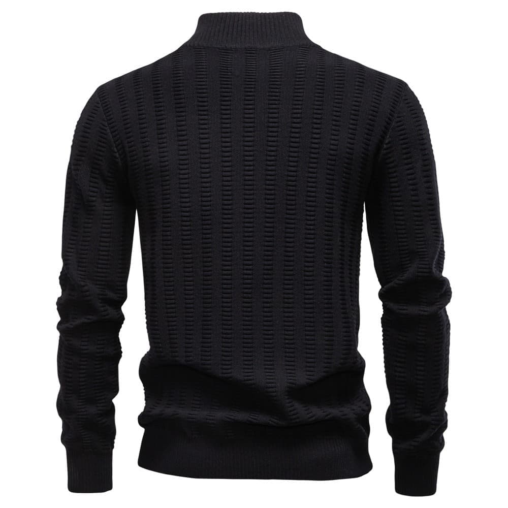 Back view of a black textured quarter-zip knit sweater with a stand collar and geometric knit pattern on a white background.