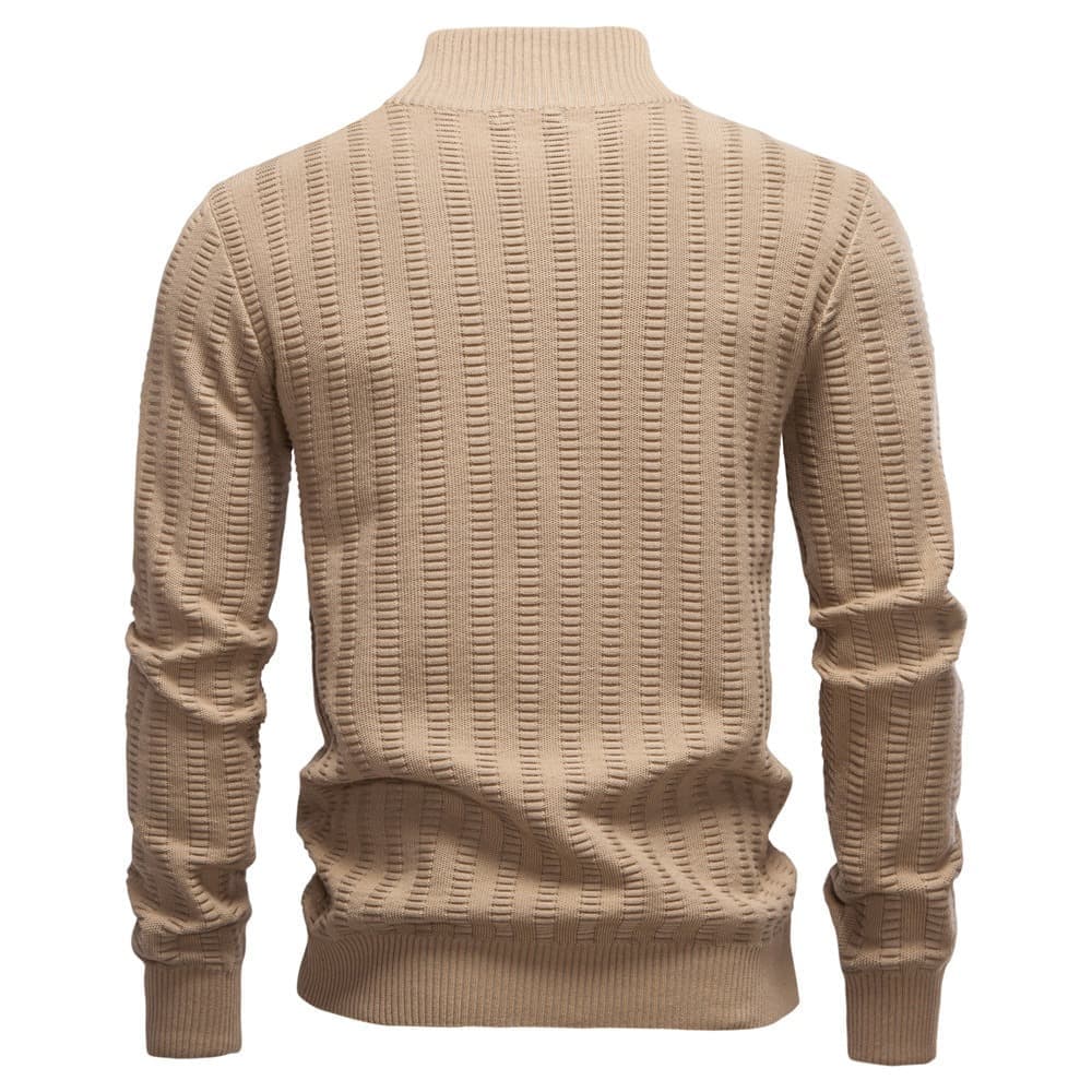 Back view of a beige textured quarter-zip knit sweater with a stand collar and geometric knit pattern on a white background.