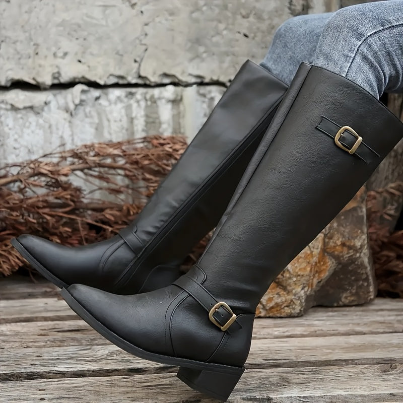 Black knee-high boots with structured shafts, antique brass buckles at the ankle and cuff, and a low stacked block heel.