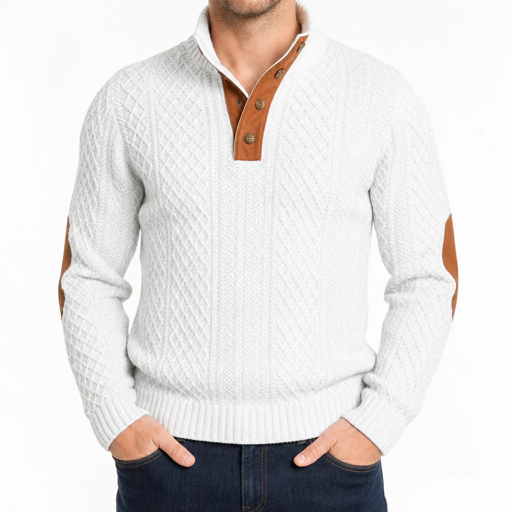 White cable-knit henley sweater featuring a mock neck, button placket, and contrast brown elbow patches.