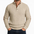 Beige cable-knit henley sweater with a mock neck, button placket, and brown contrast elbow patches.