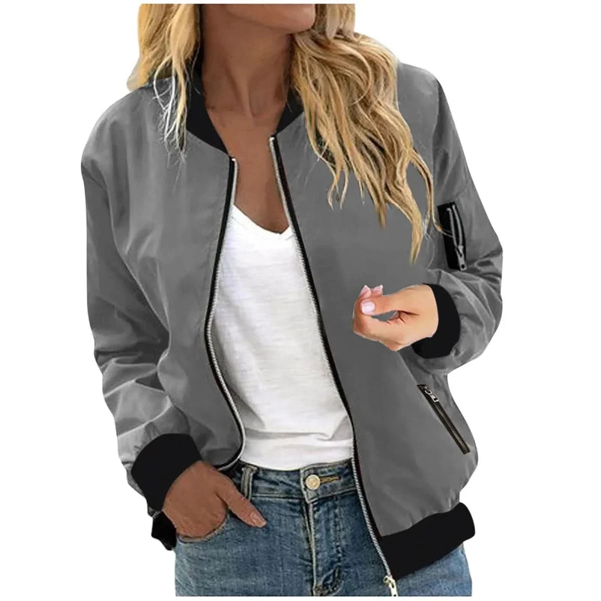 Woman wearing a gray bomber jacket featuring a full-zip front, ribbed cuffs, and a relaxed fit over a white tank top.