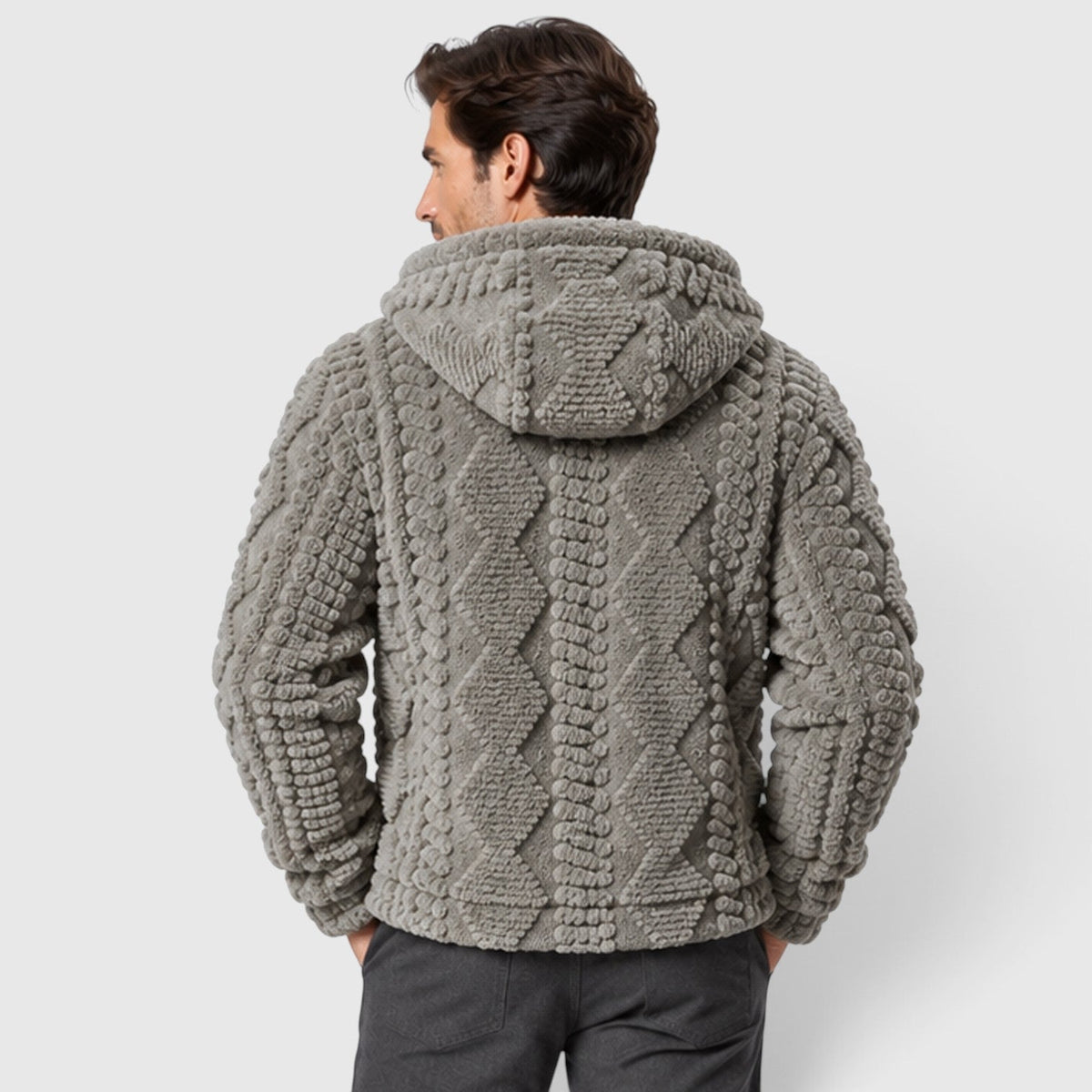 Back view of a man wearing a light gray hooded cable-textured fleece jacket.