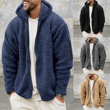 A man wearing a navy blue hooded teddy fleece jacket, with small side thumbnails displaying the black, grey, and tan color options.