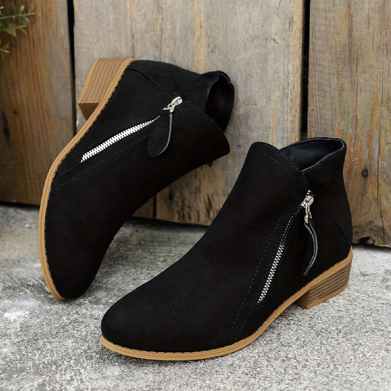 Black brushed-finish low-cut booties with almond toes, angled silver side zips, and stacked low block heels.