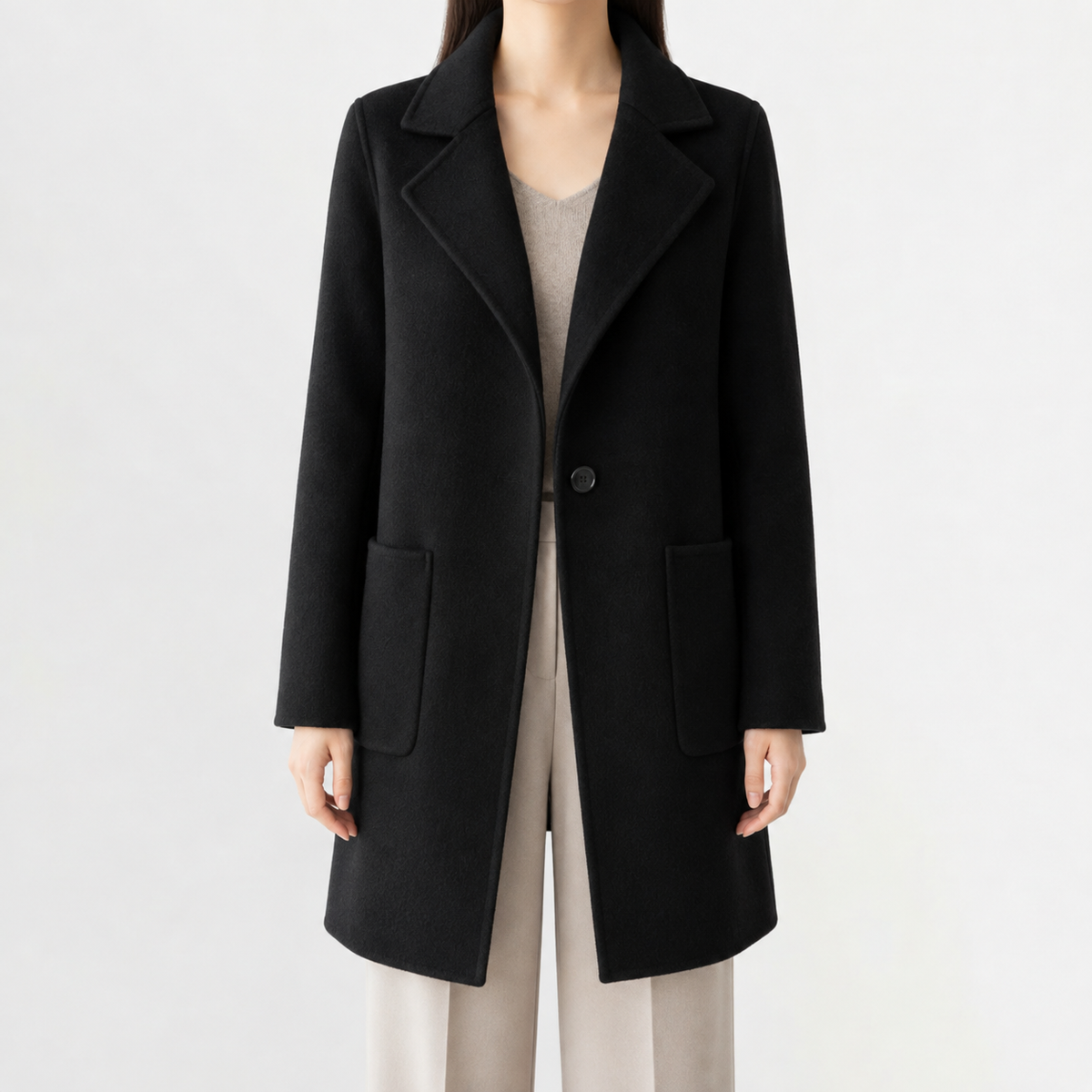 Black mid-length wool coat with a notch lapel, single-button front, and square patch pockets in a soft-touch finish.