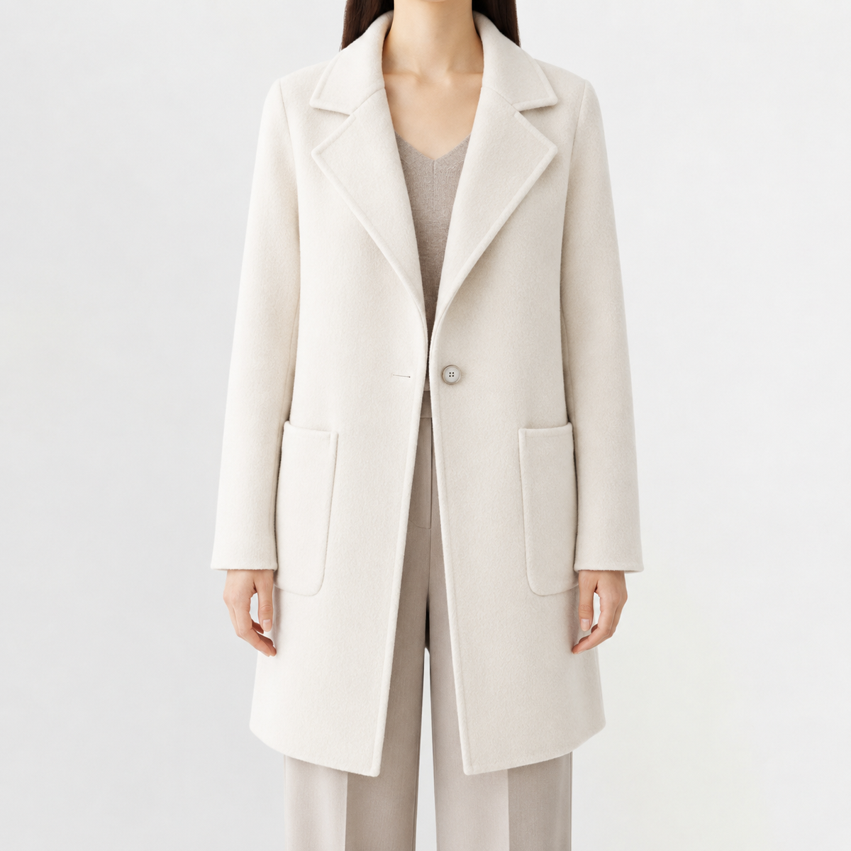 Cream mid-length wool coat with a notch lapel, single-button front, and square patch pockets in a soft-touch brushed finish.