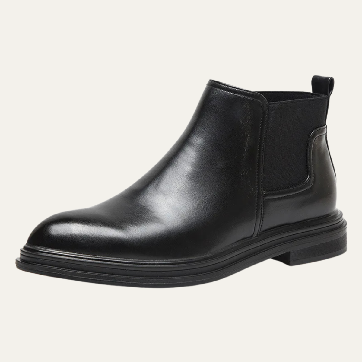 Black leather Chelsea boots featuring a round toe, elastic side gore, and a sturdy lug sole for grip.