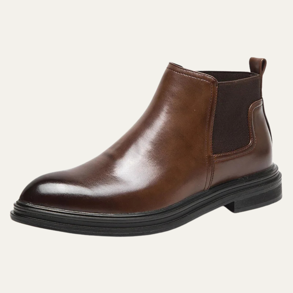 Brown leather Chelsea boot with a round toe, elastic side gore, and a chunky black lug sole for added grip.