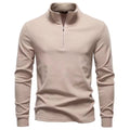 Beige brushed quarter-zip sweater with a matte finish, upright funnel collar, and a clean, straight-fit silhouette.