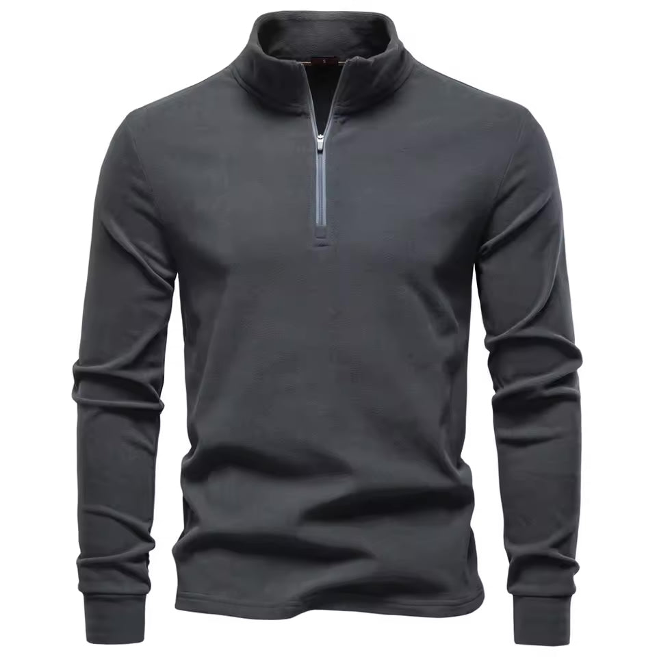 Charcoal grey brushed quarter-zip sweater with a structured funnel collar and smooth, matte finish in a straight fit.