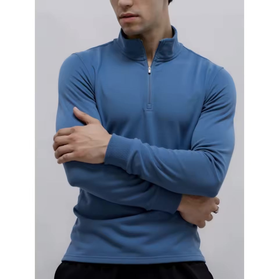 Blue brushed quarter-zip sweater with a matte finish, funnel collar, and trim straight fit on a model.