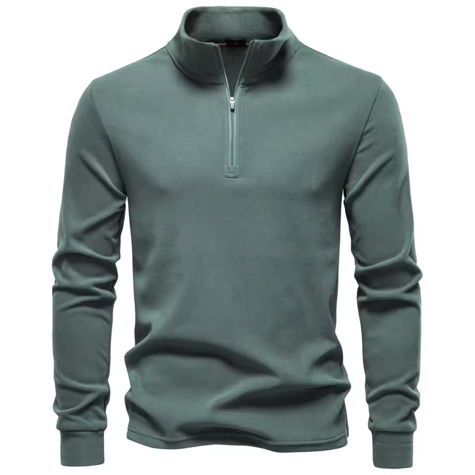 Sage green brushed quarter-zip sweater with a structured funnel collar and a smooth, matte finish in a straight fit.