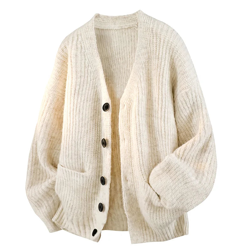 Oversized cream chunky knit cardigan with a fuzzy rib texture, V-neck, button front, and front patch pockets.