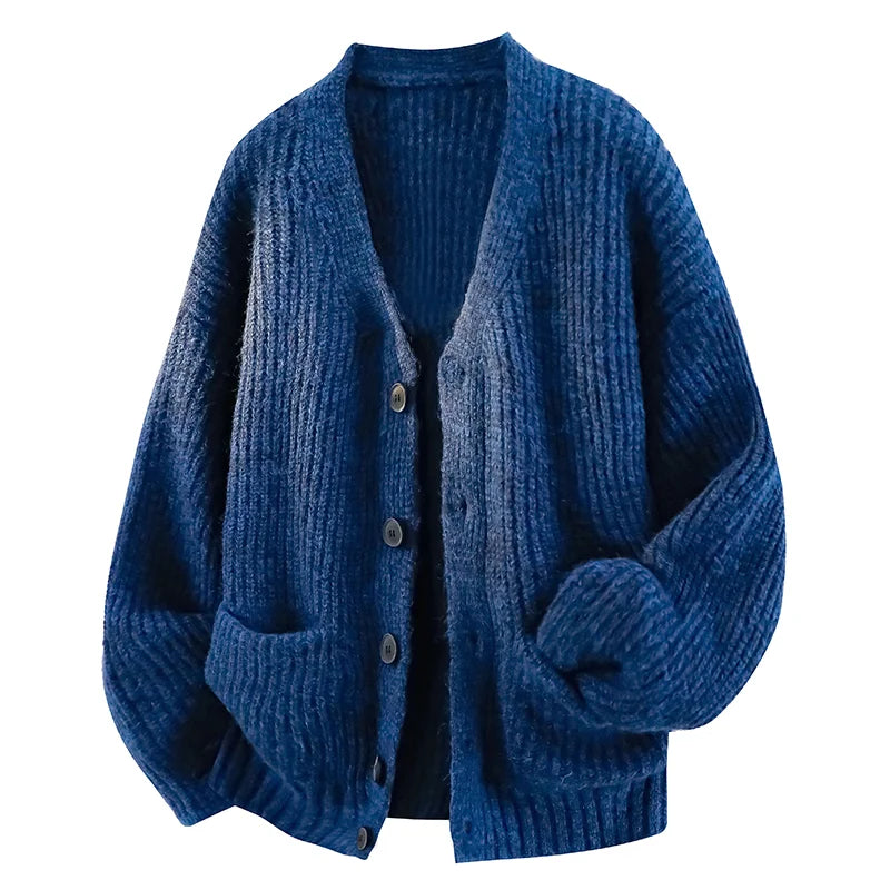 Oversized navy blue chunky knit cardigan with a V-neck, button front, dropped shoulders, and front patch pockets.